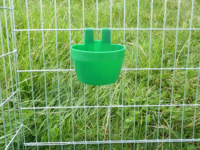 Cage feeding or drinking cup in cage