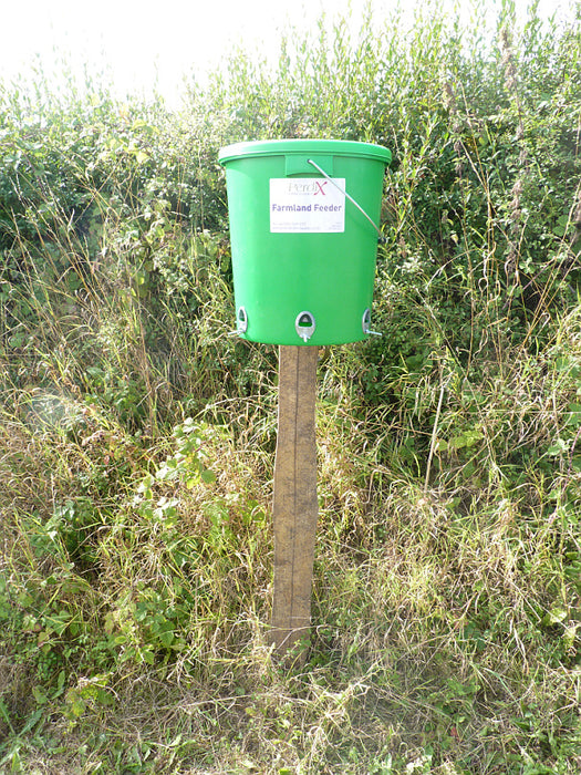 Perdix Farmland Bird Feeder mounted on a post. This post mount has been specifically designed to allow the PERDIX Farmland Bird Feeder or the PERDIX Game Bird Feeder to be quickly, easily and securely attached to any fence post or tree. 