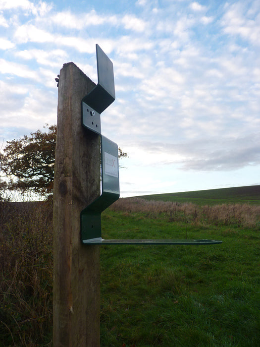PERDIX Farmland Feeder Post mount high on a post.This post mount has been specifically designed to allow the PERDIX Farmland Bird Feeder or the PERDIX Game Bird Feeder to be quickly, easily and securely attached to any fence post or tree. 
